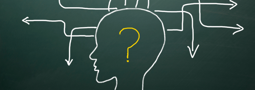 Side of head with a question mark on a chalk board